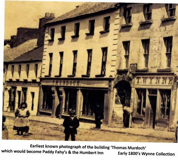 Earliest_known_photo_of_Humbert_Faheys_Building_pre_1865.jpg