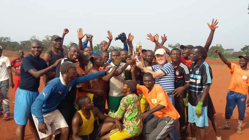 Presenting_the_cup_to_the_winning_team_in_the_Local_Security_Guards_soccer_competition.jpg