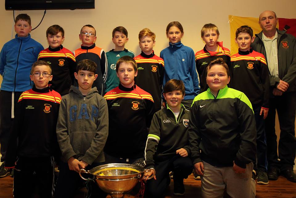 u12_county_champions_coach_Martin_O_Donnell_and_the_nicky_rackard_cup_at_presenatation_night_2016.jpg