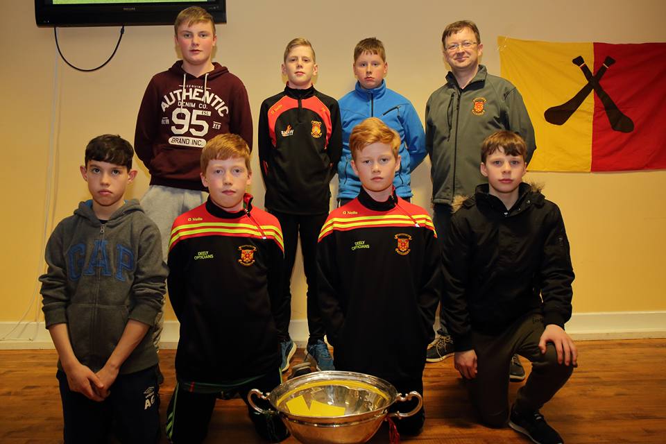 u13_county_champions_hurlers_with_coach_Aiden_O_Shea_and_the_nicky_rackard_cup_at_presenatation_night_2016.jpg