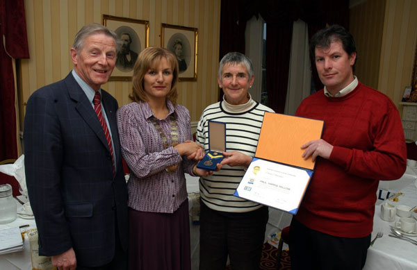 John Kilkelly, Vivenne Kyne, President Castlebar Rotary Club 2005-2006, Elaine Devereaux Castlebar Four Days Walks, and John Kilcullen presenting the Paul Harris Award to Ms Devereaux