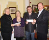 Presenting a cheque to Mayo Autism Action