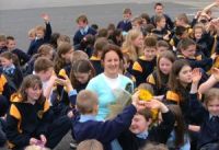 Pupils surround Miss Rowley