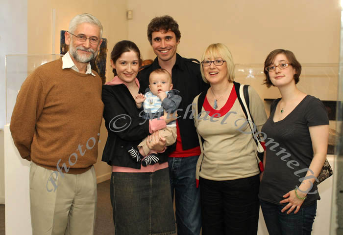 Pictured in the Linenhall Arts Centre at the official opening of "On The Edge - Contemporary Glass from Ireland and South West England" exhibition from left: Martin McGarrigle,  Dr Deirdre McGarrigle and David LaCross with baby Aidan, Regina McGarrigle, Neasa McGarrigle. Photo Michael Donnelly.