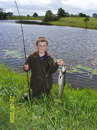 Young Tom Lynch catches his first salmon. Click on photo for more details