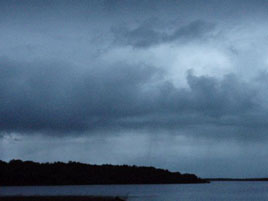 Heavy showers sweeping across Lough Conn just after sunset. Click photo for more from a darkening October shoreline.