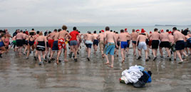 A cool photo! Tom Campbell captured a fleeting glimpse of the Christmas Day Bathers at Bertra Beach. Click photo for more.