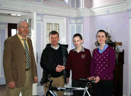 Noel Gibbons presents Patrick Lydon with his prize as winner of Bike to School Week in Coláiste Mhuire. Click on photo for more details.