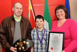 Jordan McCormick, Castlebar, winner of the recent World Irish Dancing Championships held in Philadelphia photographed with his parents. Click for more photos by Tom Campbell from the recent civic reception .