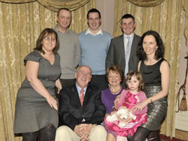 Martin Feeney with his family at his retirement function in the Welcome Inn. Click on photo for more from Ken Wright.