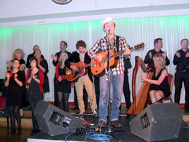 Mundy on stage at the TF with the Castlebar Gospel Choir. Click on photo for a review of the concert. 