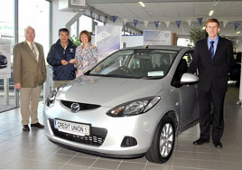 Pat and Margaret Duffy from Parke winners of a new Mazda in Castlebar Credit Union members' summer car draw. Click on photo for details from Ken Wright.