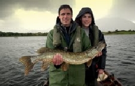 Kevin Dyra and son John, Chicago, with one of six pike caught recently near Foxford. Click on photo for more angling news from the Western River Basin District.