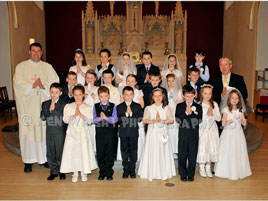 Ken Wright photographed pupils from Scoil Raifteiri who made their First Holy Communion recently. Click on photo for enlargement.