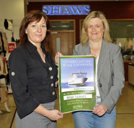 Miriam Leonard picks up her prize at Shaws. Click on photo for the details from Ken Wright.