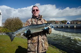 A very special catch, Eoin Trill heart transplant patient just 5 months ago catches the first salmon of the year at the Galway salmon weir.