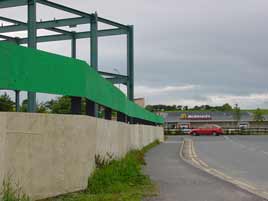 The metal frame for the new Aldi supermarket to the left facing MacDonalds