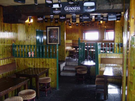 Complete view of back of bar from under small arch.