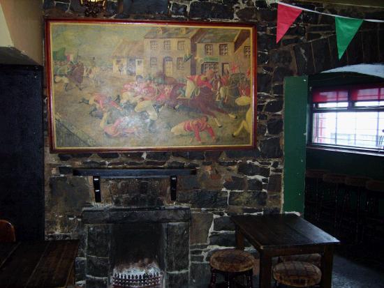 Painting hanging over historic Humbert fireplace