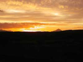 The sun sets over the reek. Photo courtesy Dalemedia