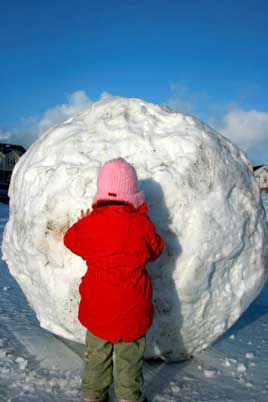 Greg Barry uploaded this photograph of a little girl playing with a giant snowball in Castlebar - click photo for more.