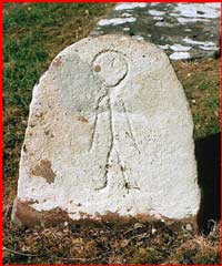 Mayo Historical and Archaeological Society's webpage has a photo and discussion about this unusual gravestone at Strade. Click photo for more details.