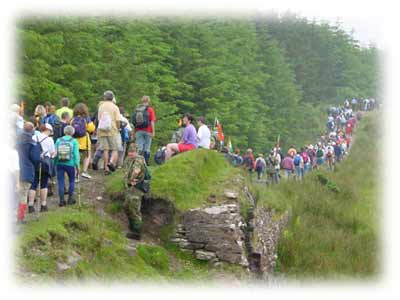 Walkers crossing the bridge at Burren Castlebar on the Four Days Walks Mayo Ireland