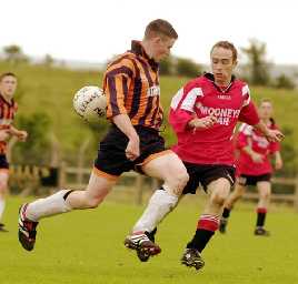 Niall McNulty, Straide and Foxford United and Maurice Welsh, Ballinrobe Town at Milebush, Castlebar, Co. Mayo, Summer 2000.<br> Photo: Keith Heneghan / Phocus