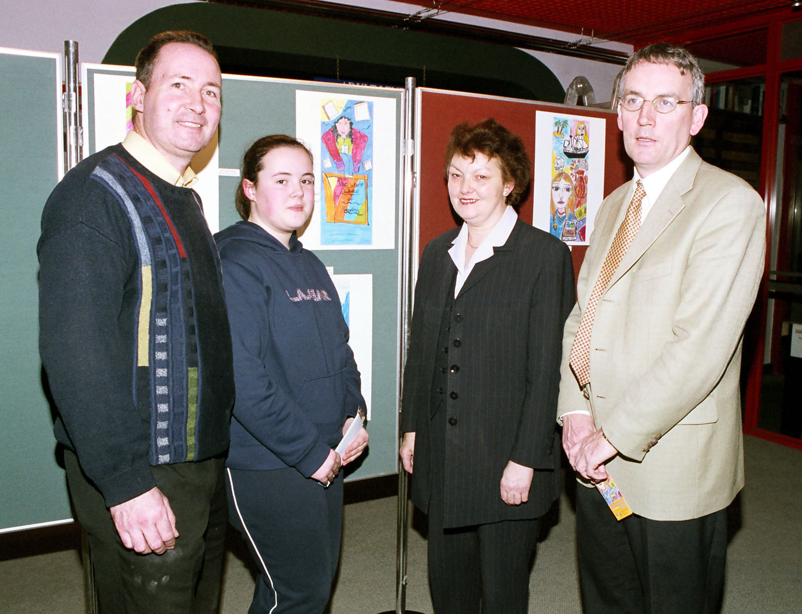 Pictured at Castlebar Library, the Bookmark design competition from Book Week Merit Award Winner Grace Ryan. L-R: Pat Ryan, Grace Ryan, Mary Conway, Austin Vaughan (County Librarian). Photo  Ken Wright Photography 2004.
