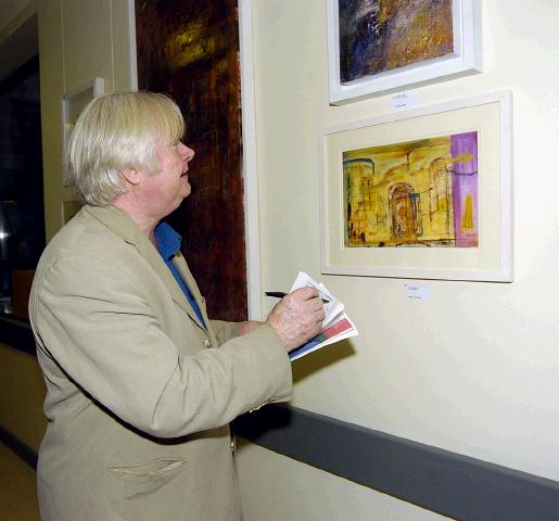 GMIT BA Graduates Art & Design 2007  Turas exhibition held in Mayo General Hospital which was opened by John Behan RHA and will runs from  23rd August until the 23rd October. John Behan looking at some of the work on display .Photo  Ken Wright Photography 2007
