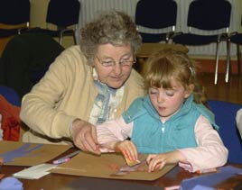 Rena Maloney helps her granddaughter at a visual arts workshop in Balla Community Centre. Click photo for more details from Ken Wright.