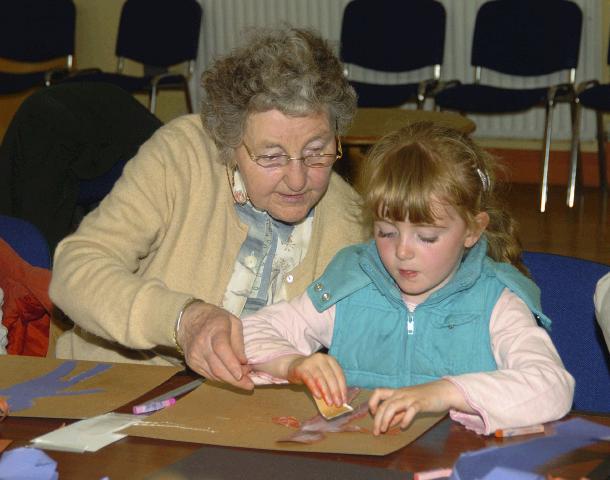 Breda Murphy presenting a visual arts workshop in Balla Community Centre, part of the Arts Office Bealtaine Celebrating Creativity in Older Age. Catherine Lyons helping her grandmother Rena Maloney . Photo  Ken Wright Photography 2007.