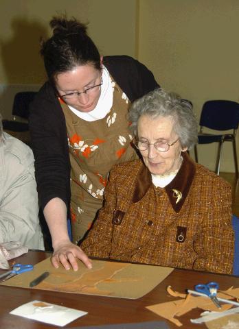 Breda Murphy presenting a visual arts workshop in Balla Community Centre, part of the Arts Office Bealtaine Celebrating Creativity in Older Age. Nora Gavin with Breda Murphy  Photo  Ken Wright Photography 2007.
