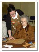 Breda Murphy presenting a visual arts workshop in Balla Community Centre, part of the Arts Office Bealtaine Celebrating Creativity in Older Age. Nora Gavin with Breda Murphy  Photo  Ken Wright Photography 2007.