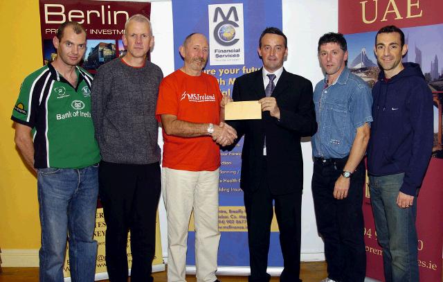 Balla 10k Road Race which was held on 28th July and raised 32,300 Euro which was divided between various charities.  Presentation of a cheque for 2,000 Euro to MS Ireland Mayo Branch L-R: David Hune (Mayo Athletic Club), Michael McGrath, (Mayo Athletic Club),  Duncan Pratt (Mayo MS),   Brendan Conwell (Chairman  Balla 10k Road Race), Paddy Murray (Mayo Athletic Club),  TJ McHugh (Mayo Athletic Club),. Photo  Ken Wright Photography 2007. 

