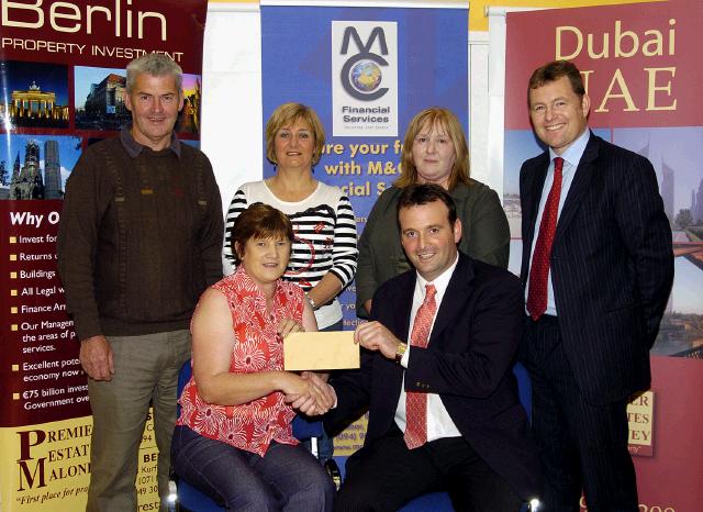 Balla 10k Road Race which was held on 28th July and raised 32,300 Euro which was divided between various charities.  Presentation of a cheque for 4,500 Euro to Huntingdons Disease Association Front L-R: Ann Hannon (Huntingdons Disease Association), Cyril Burke (sponsor Premier Estates Maloney). Back L-R: Joe Hannon 
Huntingdons Disease Association, Mary Brett (Road Race Committee), Patricia Conwell (Road Race Committee), Michael Maloney (sponsor Premier Estates Maloney). Photo  Ken Wright Photography 2007. 

