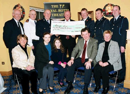 Garda presentation of a cheque to the Bright Eyes Fund for the breast cancer scanner for Mayo General Hospital. Front L-R: Marie Mellett (DWard Mayo General Hospital), Mary Casey (Consultant Radiologist MGH), Nicole Devaney, Kevin Barry (Consultant Surgeon MGH), Asumpta Walsh (Clinical Nurse Specialist Breast Care) Back L-R: Jonathan Hanahan (Consultant Radiologist MGH), Supt. Padraic OToole (Claremorris), Chief Supt. John Carey
(Castlebar), Denis Gallagher (Chairman Bright Eyes Fund), Asst. Commissioner Dermot Jennings (Galway), Inspector Willie Keaveany (Castlebar), Inspector Pat Diskin (Galway): Photo  Ken Wright Photography 2004. 
