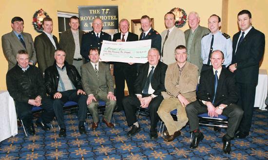 Garda presentation of a cheque to the Bright Eyes Fund for the breast cancer scanner for Mayo General Hospital. Front L-R: Sgt. Martin McDermott (Ballyhaunis), Sgt. John Flannery (Belmullet), Sgt. Joe McKenna (Castlebar), Garda Michael Fadden (Belmullet), Christy Hyland (Retired Garda Westport), Garda Tommy Lyons (Ballina). Back L-R: Sgt. Eamon Bresnan (Castlebar), Garda Linus Fahey (Westport), Sgt. Joe Docherty (Ballina), Chief Supt. John Carey (Castlebar), Denis Gallagher (Chairman Bright Eyes Fund), Asst. Commissioner Dermot Jennings (Galway), Sgt. Thomas McIntyre (Kiltimagh), Garda John Moran (Swinford), Garda Denis Harrington (Westport), Sgt. Tony Cosgrove (Castlebar): Photo  Ken Wright Photography 2004.