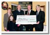 Garda presentation of a cheque to the Bright Eyes Fund for the breast cancer scanner for Mayo General Hospital. L-R: Nicole Devaney, Nora Devaney, and Chief Supt. John Carey
(Castlebar), Denis Gallagher (Chairman Bright Eyes Fund), Michael Devaney.
 Photo  Ken Wright Photography 2004. 
