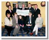 Garda presentation of a cheque to the Bright Eyes Fund for the breast cancer scanner for Mayo General Hospital. Organising Committee Front L-R: Marie Mellett, Nora Devaney,
Nicole, Michael Devaney, Helen Sarsfield, Back L-R: Marianne Jordan Chief Supt. John Carey (Castlebar), Denis Gallagher (Chairman Bright Eyes Fund), Asst. Commissioner Dermot Jennings (Galway), Brendan Coyne:
 Photo  Ken Wright Photography 2004. 
