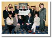 Garda presentation of a cheque to the Bright Eyes Fund for the breast cancer scanner for Mayo General Hospital. Organising Committee Front L-R: Marie Mellett, Nora Devaney,
Nicole, Michael Devaney, Helen Sarsfield, Back L-R: Brendan Coyne Marianne Jordan Chief Supt. John Carey (Castlebar), Denis Gallagher (Chairman Bright Eyes Fund), Asst. Commissioner Dermot Jennings (Galway) Frank Heraghty who produced the Show in the TF Royal Theatre, Mary & Pat Jennings Proprietors TF Royal Theatre & Hotel:  
Photo  Ken Wright Photography 2004. 
