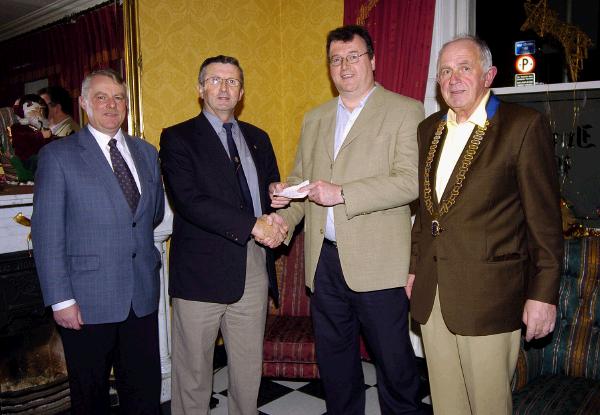 Members of Castlebar Lions Club pictured in the Imperial Hotel at a presentation of a cheque, the proceeds from the Christmas Food Appeal,  to Jerome Quinn from St. Vincent De Paul L-R: Danny Moran, Joe Staunton Treasurer , Jerome Quinn, Eamonn Horkan President Castlebar Lions Club   .Photo  Ken Wright Photography 2007.