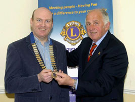 Eamon Horkan hands over the chain of office to Michael Mullahy incoming Lions Club President. Click on photo for more details from Ken Wright.
