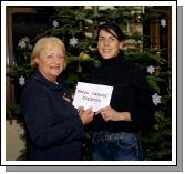 Pictured in the McWilliam Park Hotel Claremorris Angela Kirrane Manager of Services Mayo Cancer Support Association, receiving a cheque for 2,800 Euro from Mary Gleeson  who ran the Dublin City Marathon. Mary is a member of the Mayo Athletic Club . Photo  Ken Wright Photography 2007. 