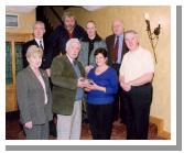Pictured in the Welcome Inn  at presentation by the Irish Emigrant Liaison Committee (Mayo Branch) to Nado Cafolla in appreciation
of her contribution to the committee and also to mark her retirement from business are. Front L-R: Mary Doyle, Johnny Mee Chairman MELC, Nado Cafolla, James OMalley. Back L-R: Joe ODea, Mick Morgan, Blackie Gavin, Kevin Bourke. Photo  Ken Wright Photography 2004 

