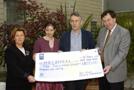 At the presentation of a cheque for 1,850 euro to Mary Casey for the MRI Scanner Appeal by Austin Vaughan County Librarian.
