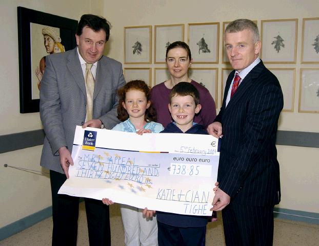 Pictured in Mayo general Hospital at a presentation of a cheque for 738 euro 85 cents from Katie, Cian and the Tighe Family Gallows Hill Castlebar the proceeds of their Christmas Lights Appeal in aid of the MRI Scanner. The family would like to thank everyone who contributed so generously. L-R: Mr Kevin Barry (Consultant Surgeon Mayo General Hospital), Mary Casey (Consultant Radiologist Mayo General Hospital), Tony Canavan (Manager Mayo General Hospital), Front Katie and Cian Tighe. Photo  Ken Wright Photography 2007. 

