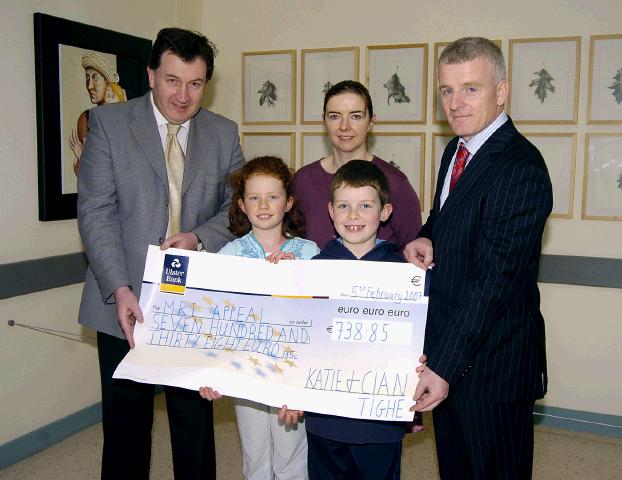 Pictured in Mayo general Hospital at a presentation of a cheque for 738 euro 85 cents from Katie, Cian and the Tighe Family Gallows Hill Castlebar the proceeds of their Christmas Lights Appeal in aid of the MRI Scanner. The family would like to thank everyone who contributed so generously. L-R: Mr Kevin Barry (Consultant Surgeon Mayo General Hospital), Mary Casey (Consultant Radiologist Mayo General Hospital), Tony Canavan (Manager Mayo General Hospital), Front Katie and Cian Tighe. Photo © Ken Wright Photography 2007.
