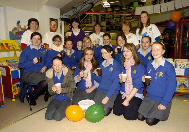 Pictured are members of the Irish Wheelchair Association who held a coffee morning in Castlebar Library in aid of the Telethon People In Need. Students from St. Josephs Secondary School were there to lend a helping hand Front L-R: Nicola Molloy, Sinead Guerin, Stacey Rice, Niamh Dunne, Maeve Tierney Middle L-R: Aisling Lydon, Kayleigh Garrett, Ciara Conway, Niamh ONeill, Ann Horan, Emer Carney, Samantha McDonagh. Back L-R: Caroline Madden, Frances Spindler, Martina Reid (organiser),Carmel Monaghan, Bridie OConnor, Fiona Gallagher. Photo  Studio 094. 