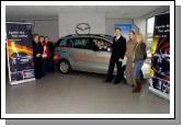 John OShaughnessy (Mayo Co-Ordinator Special Olympics), receiving the keys of a Mazda 5 courtesy car,  from David Monaghan (Monaghan & Sons Breaffy Rd Castlebar),  L-R: Pauline Flynn (Special Olympics), Jackie Murphy (Special Olympics), Ann Cattigan (Special Olympics),  John OShaughnessy, David Monaghan, Ryan Ring (Graphics Manager Connacht Signs) who designed the sign writing on the car for the Special Olympics, Maggie Ahern (Special Olympics) . Photo  Ken Wright Photography 2007